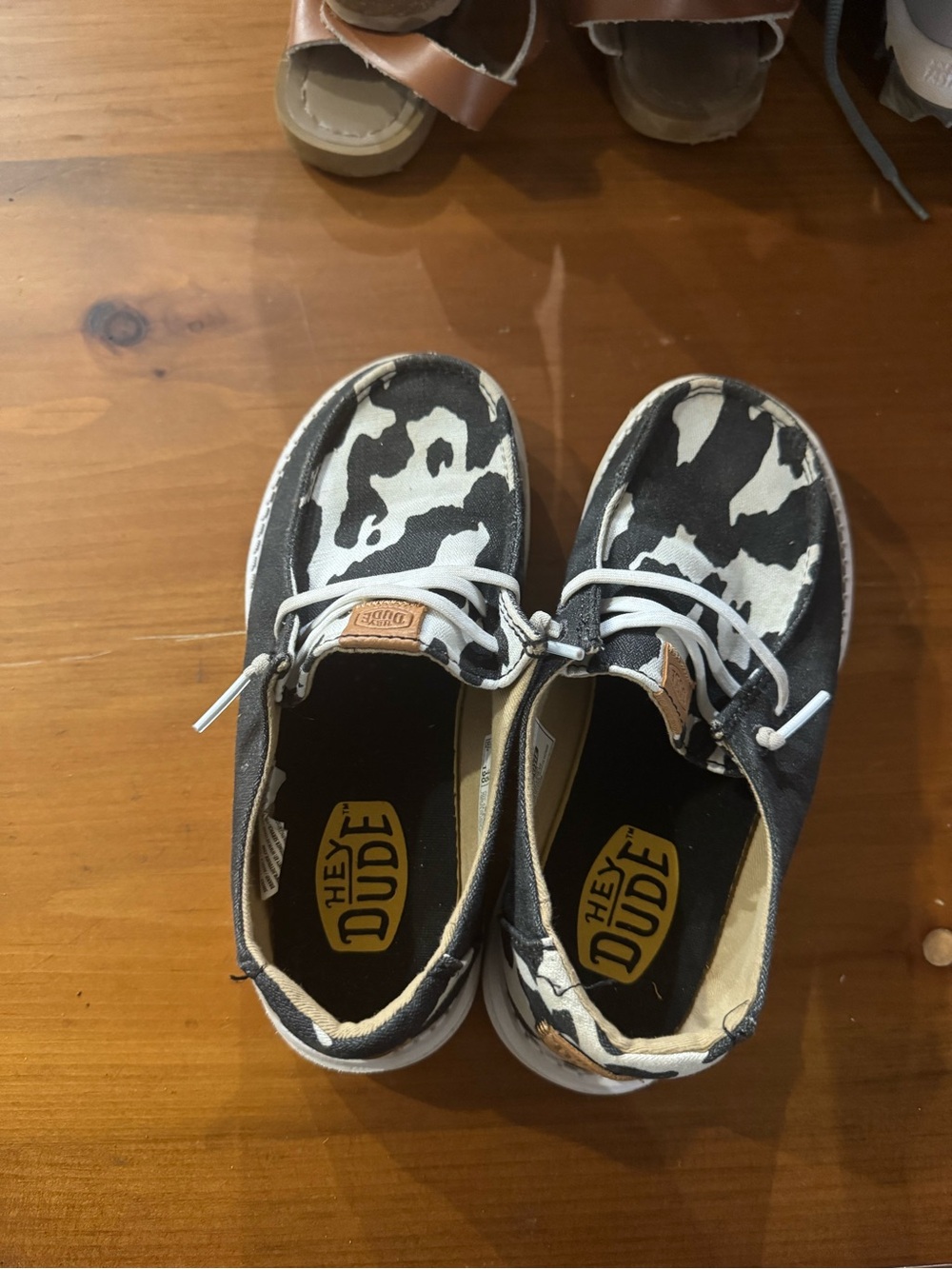 Hey Dude Kids Canvas Slip-Ons in Black & White Cow Print